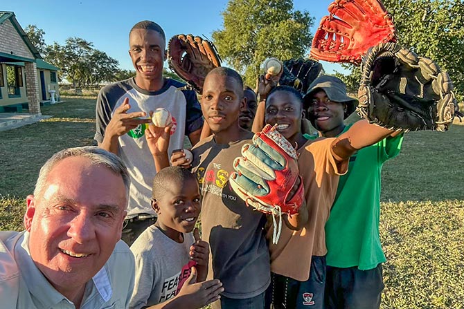 man and a group of kids