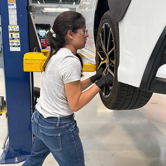 Woman fixing a car